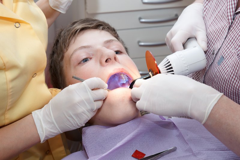 teen receiving dental sealants