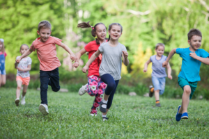 a group of children playing during the summer