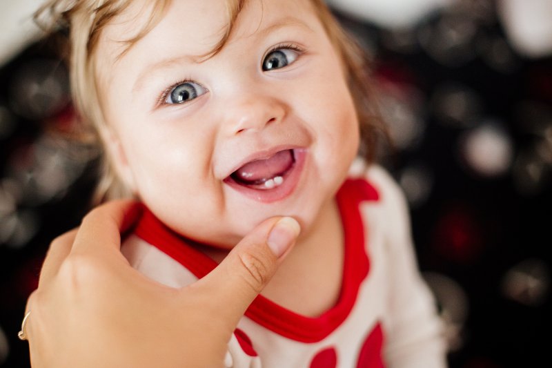 infant with two bottom teeth